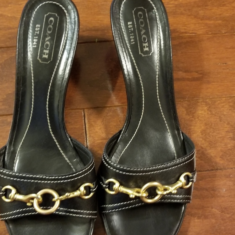 Gently used pair of Coach Stack Heal Mules Size